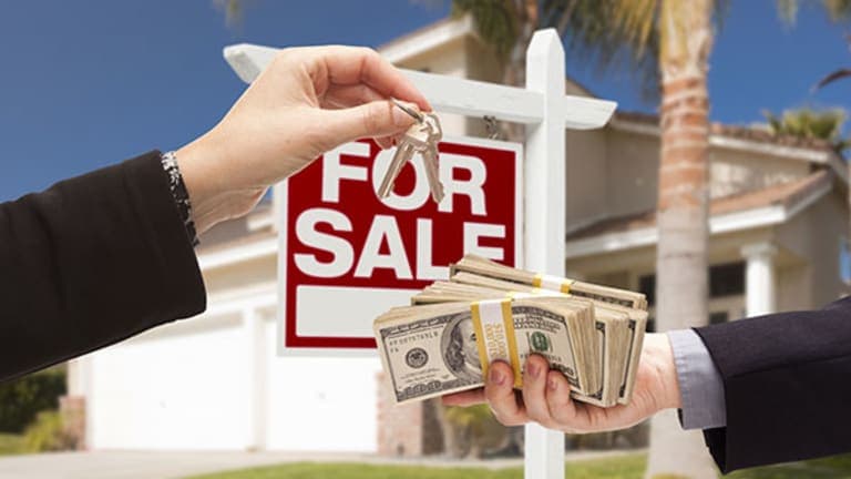 Real Estate Sales - Home with For Sale sign and financial transaction